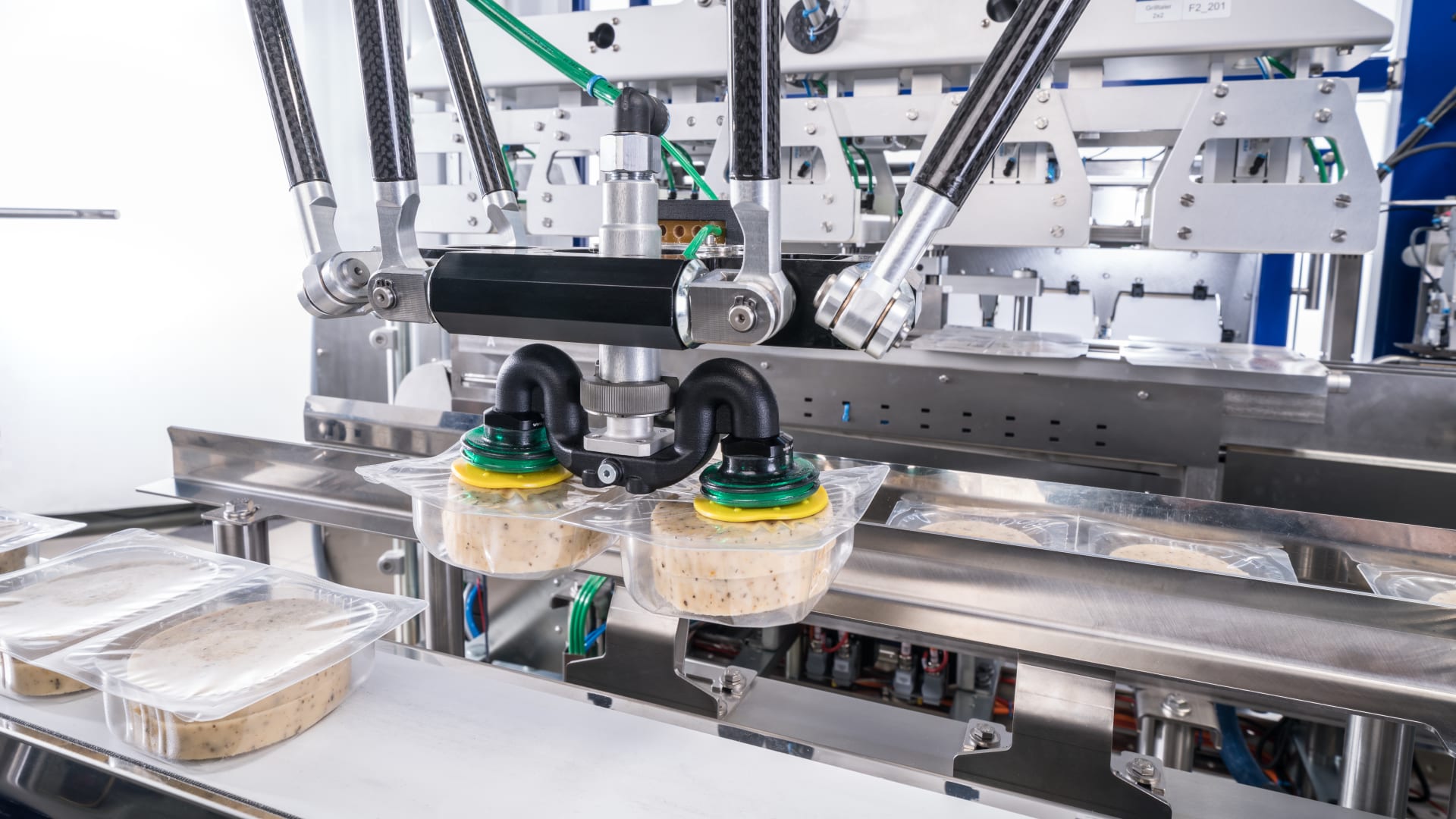 Barbecue cheese rounds neatly wrapped with sleeves Schubert Group